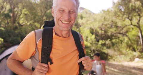 Smiling Hiker enjoying Outdoor Camping Adventure - Download Free Stock Images Pikwizard.com