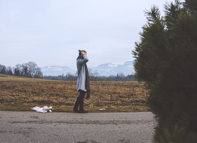 Woman Walking in Countryside During Winter Day - Download Free Stock Images Pikwizard.com