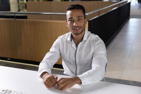 Confident professional at modern office workspace