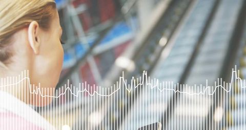 Business traveler holding phone with conveyor belt background