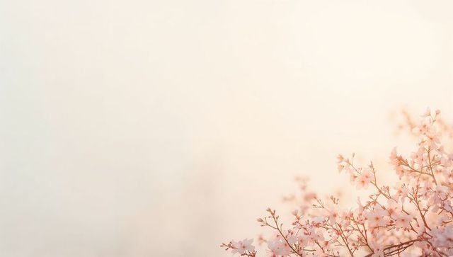 Pale pink cherry blossoms on slender branches with soft pastel bokeh and airy copy space