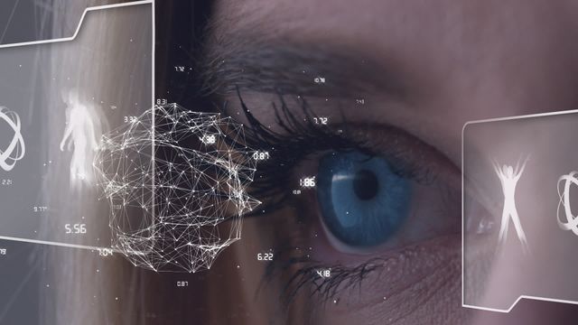 Video features a close-up of a woman's blue eye engaging with holographic technology, showing a digital globe and human anatomy on an interactive display. Ideal for concepts related to advanced technology, surveillance, healthcare innovation, biometric analysis, and AI-driven interfaces.