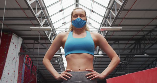 Fit Woman Wearing Face Mask in Indoor Climbing Gym - Download Free Stock Images Pikwizard.com