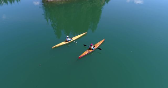 Two People Kayaking on Serene Lake with Clear Skies - Download Free Stock Images Pikwizard.com