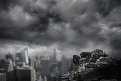 transparent rock over city with dark clouds in background - Download Free Stock Videos Pikwizard.com