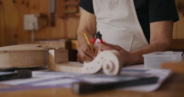 Craftsman Working on Violin in Wood Workshop - Download Free Stock Images Pikwizard.com