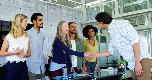 Diverse Team Shaking Hands In Modern Office Setting - Download Free Stock Images Pikwizard.com