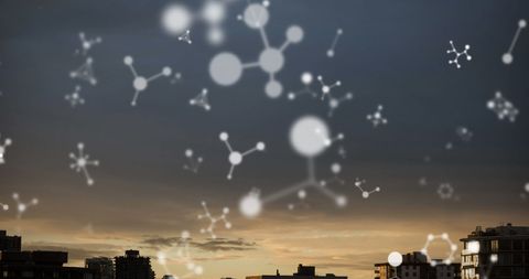 Abstract molecules overlay on city skyline at dusk