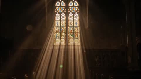 Sunbeams streaming through stained glass, casting light and dust across cathedral nave