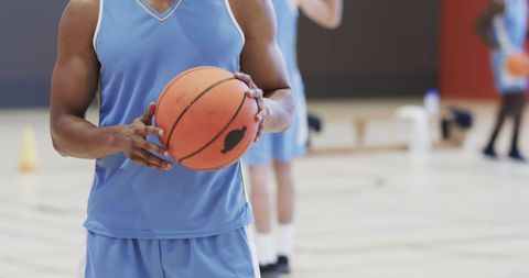 Basketball Player Holding Ball During Indoor Practice Session - Download Free Stock Images Pikwizard.com