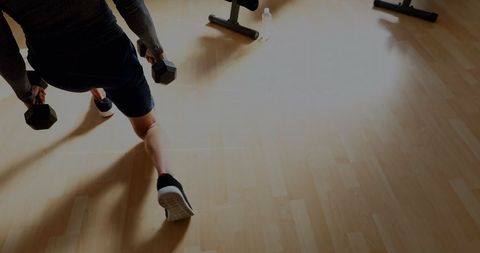 Fitness Enthusiast Performing Dumbbell Lunges Workout - Download Free Stock Images Pikwizard.com
