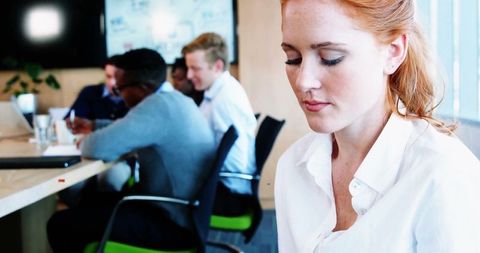 Focused Businesswoman Considering Strategy in Modern Office Setting