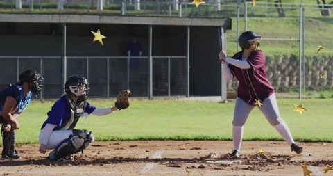 Youth baseball player batting in game with gold star overlays