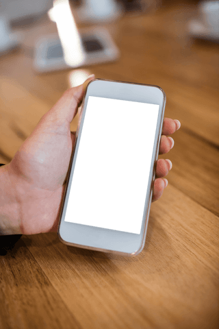 Hand Holding Transparent Phone over Wooden Table - Download Free Stock Videos Pikwizard.com