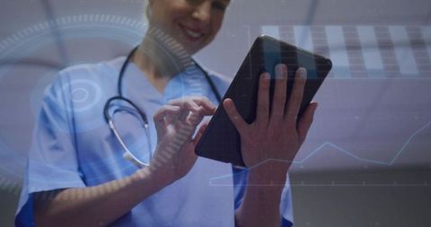 Clinician reviewing digital patient data on tablet with futuristic hud and medical graphs
