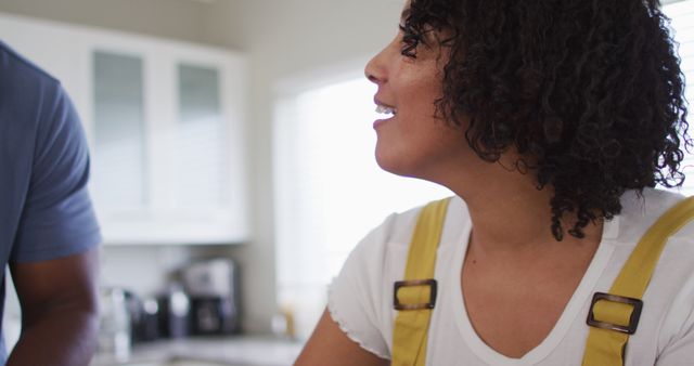 Smiling Woman with Curly Hair in Kitchen Interior - Download Free Stock Images Pikwizard.com