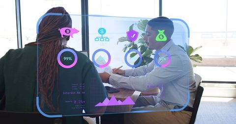 Colleagues reviewing financial analytics using augmented reality dashboard in modern office
