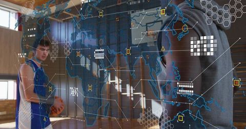 Hooded coach pointing at holographic data overlay guiding basketball player