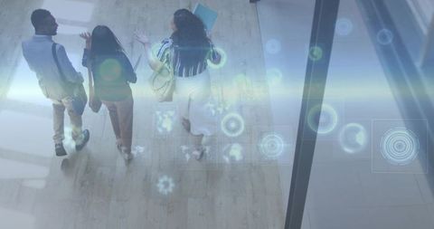 Business team walking modern office corridor with augmented hud overlay and reflections