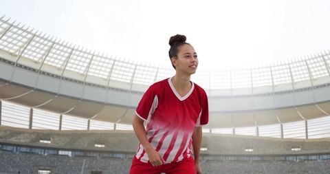 Young Female Soccer Player on Large Stadium Field