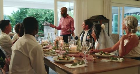 Family and Friends Celebrating at Wedding Reception Dinner