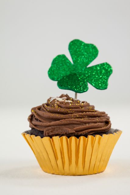 St Patricks Day shamrock on the cupcake on white background