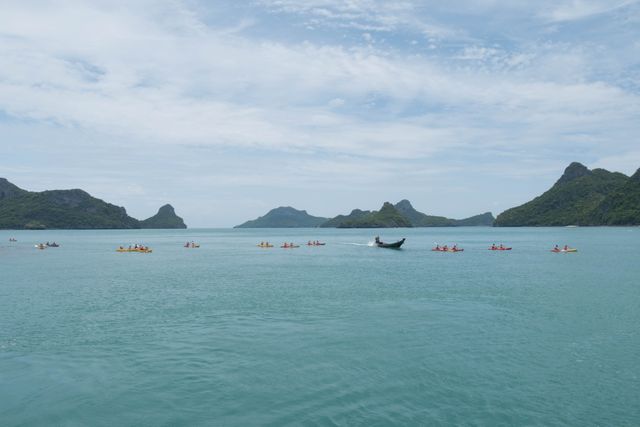 Tourists Kayaking in Scenic Ocean with Island Backdrop - Download Free Stock Images Pikwizard.com