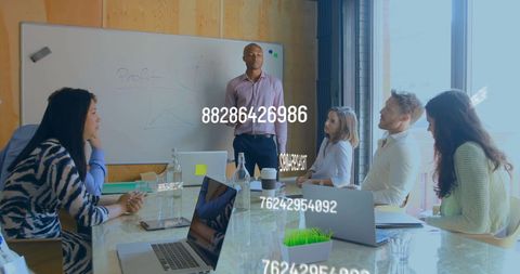 Diverse Team Discussing Data in Modern Office Meeting - Download Free Stock Images Pikwizard.com