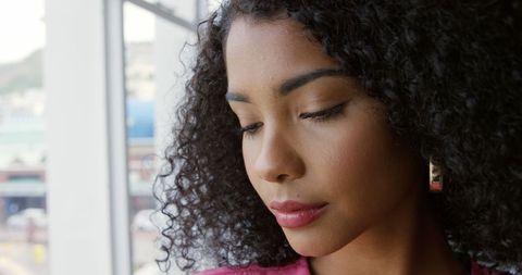 Contemplative Biracial Woman in Peaceful Reflection