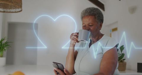 Senior Woman Tracking Heart Health via Smartphone at Home