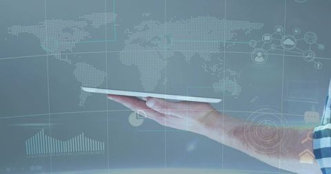 Hand holding tablet with holographic world map and digital analytics for global business