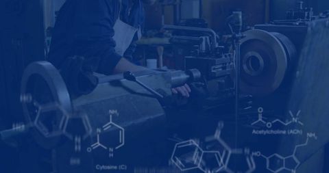 Machinist adjusting lathe chuck with chemical overlay