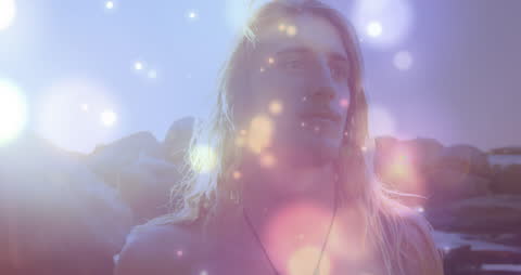 Ethereal Portrait of Lonng-Haired Man on Dreamy Beach