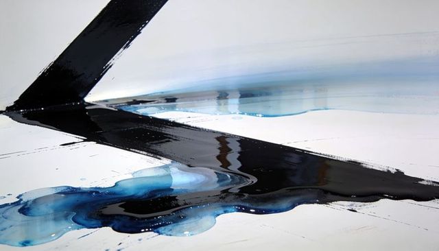 Glossy black diagonal stroke with pooling blue pigment on stretched canvas minimalist abstract