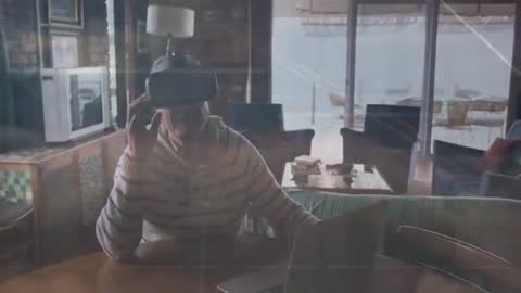 Senior Man Exploring Virtual Reality at Home with VR Headset