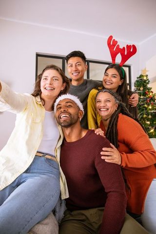 Diverse Family Celebrating Christmas With Joyful Selfie