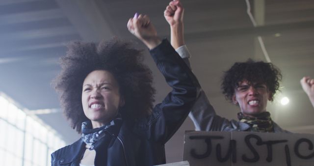 Determined Activists Protesting for Justice Indoors - Download Free Stock Images Pikwizard.com