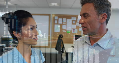 Business Colleagues Discuss Data Analytics in Office