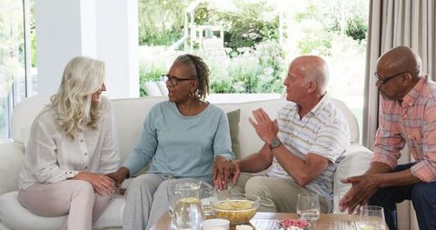 Senior Friends Engaging in Conversation at Home