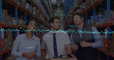 Business team analyzing financial data in warehouse
