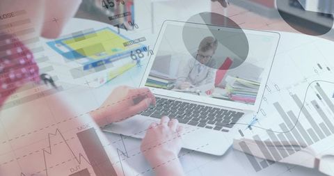 Remote learning analytics workspace hands typing on laptop with charts and graph overlays