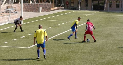 Youth Soccer Match on School Field During Play