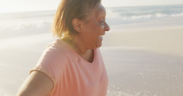 Joyful Elderly Woman Enjoying Fun Time at the Beach - Download Free Stock Images Pikwizard.com