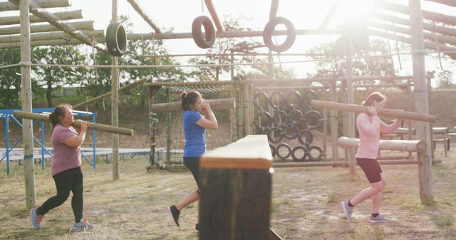 Group Training on Outdoor Obstacle Course Carrying Wooden Logs - Download Free Stock Images Pikwizard.com