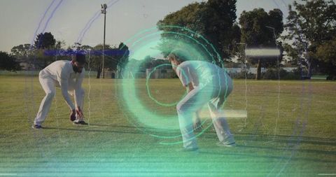 Cricket players reaching for ball on grass field with teal hud overlay