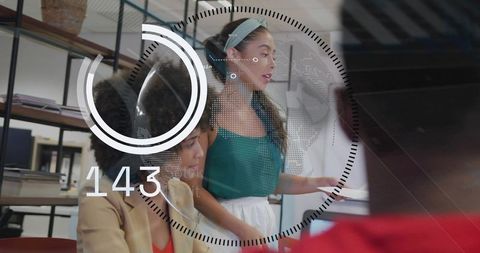 Businesswomen handing document with futuristic hud overlay in modern office collaboration