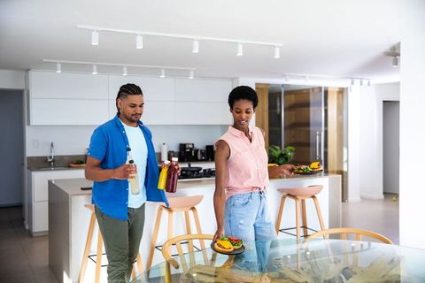 Couple Enjoying Casual Meal in Modern Kitchen Interior
