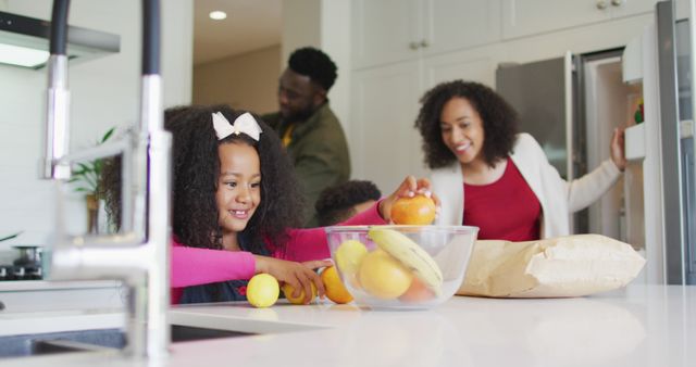 Happy Family in Modern Kitchen Preparing Fruits Together - Download Free Stock Images Pikwizard.com