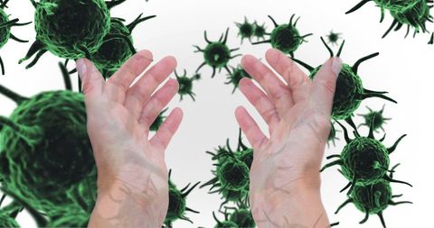 Hands Reaching Toward Green Virus Cells Illustrating Healthcare Concepts