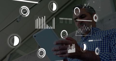 Executive analyzing tablet with holographic analytics overlay in modern atrium space